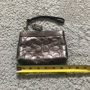 Coach metallic silver/dark gray wristlet